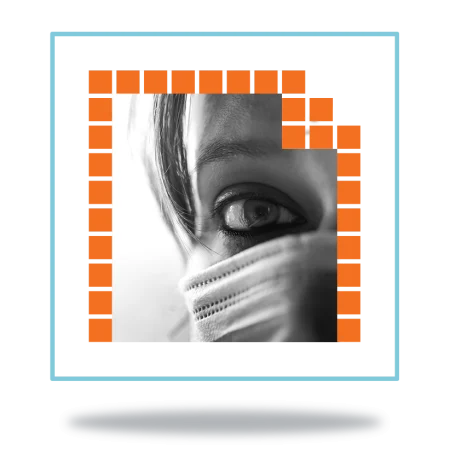 close up of a masked nurse with concerned look in her eye