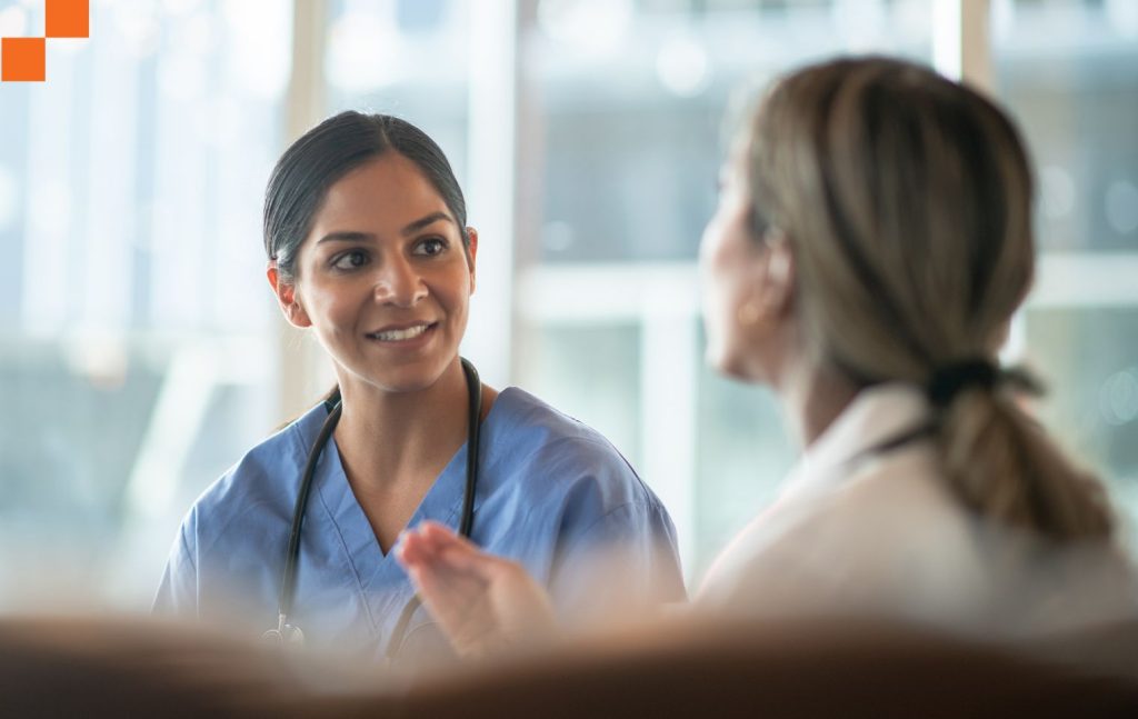 Two medical professionals talking to each other
