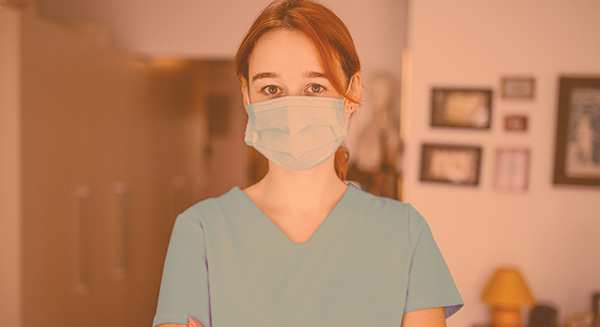 home care nurse with arms crossed looking frustrated