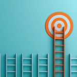 Four blue ladders and one orange ladder tall enough to reach the bullseye target