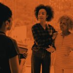 Daughter with elderly mother talking to a nurse