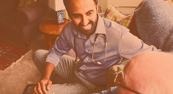 home nurse communicating with patient